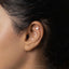 a close up of a person with a ear piercing