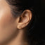 a close up of a woman&#39;s ear with a nose piercing