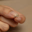 a person&#39;s hand with a ring on it