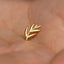 a gold ring with a leaf design on it